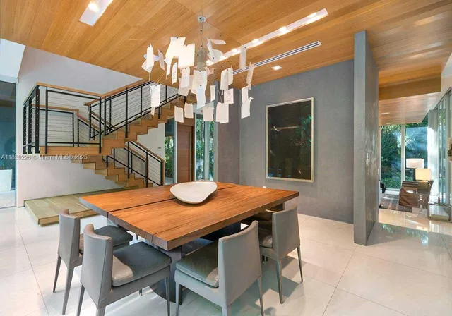 a view of a house with wooden floor and outdoor seating