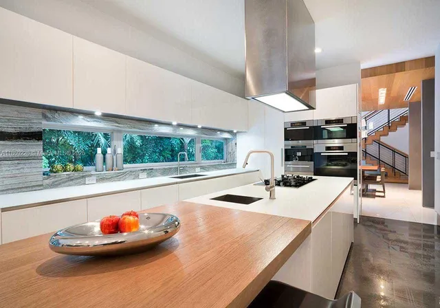 a kitchen with a table and chairs in it