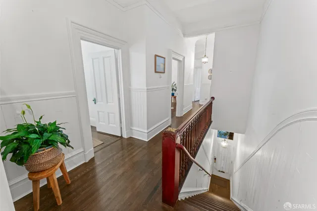 a view of an entryway with wooden floor