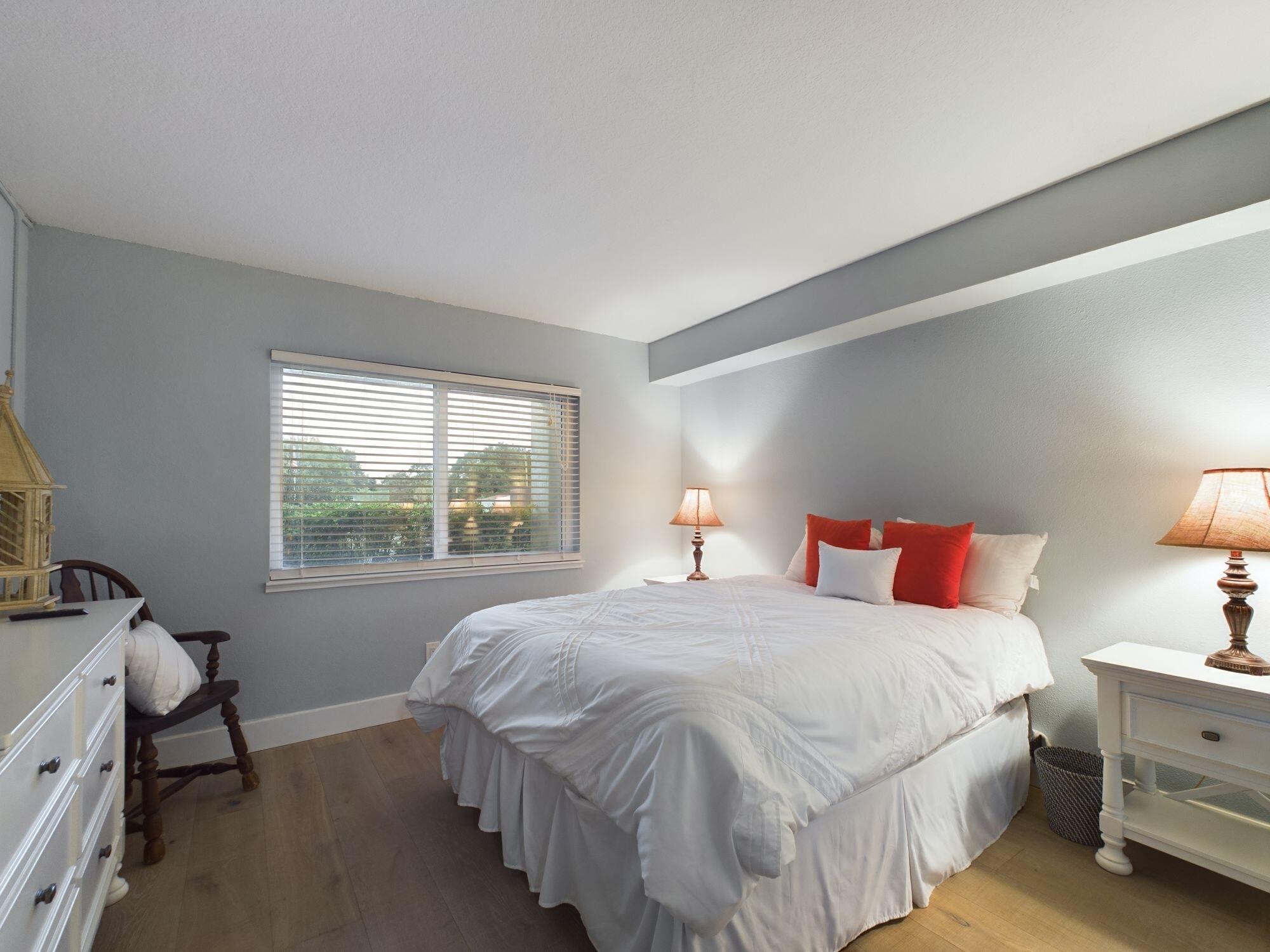 151 Calhoun Avenue, Unit 108 Destin, FL 32541 - Photo 15 of 30 a bedroom with a bed and a window