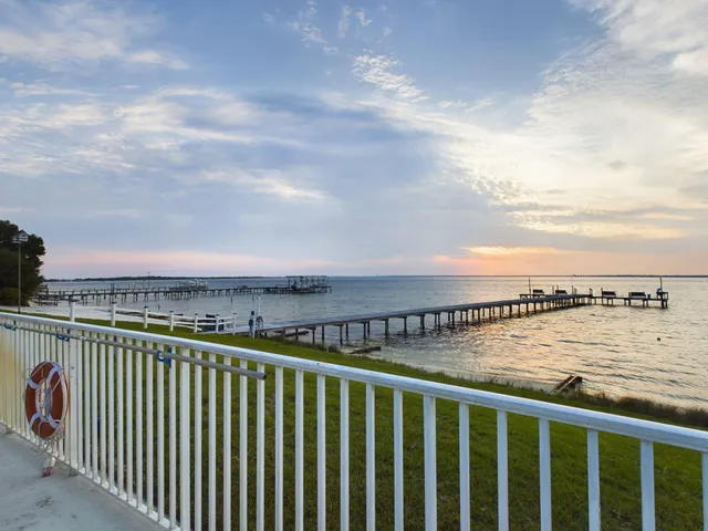 a view of a balcony next to a lake