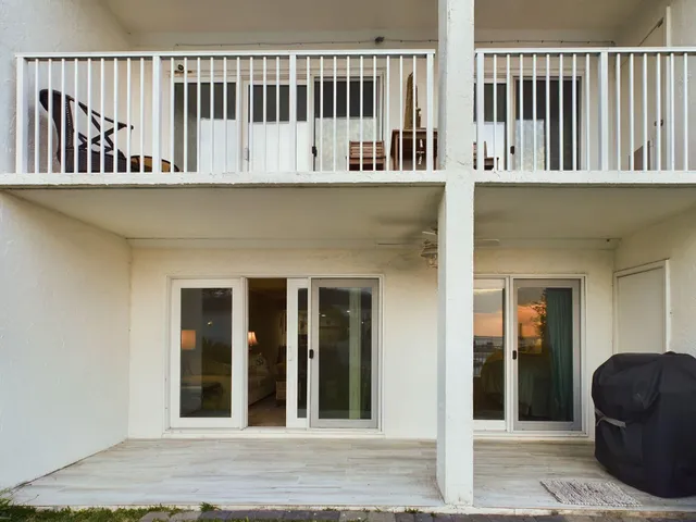 a kitchen with stainless steel appliances granite countertop a sink refrigerator and cabinets