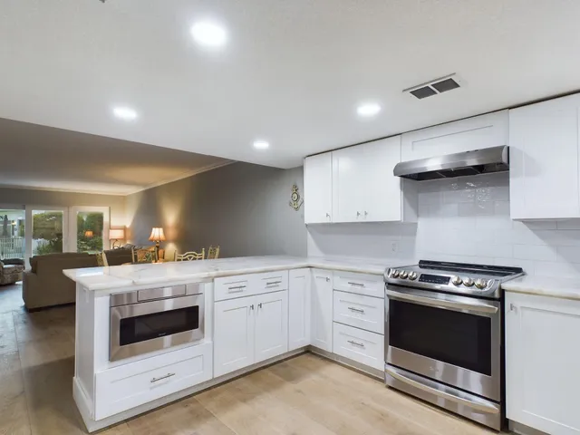 a kitchen with a stove and a sink