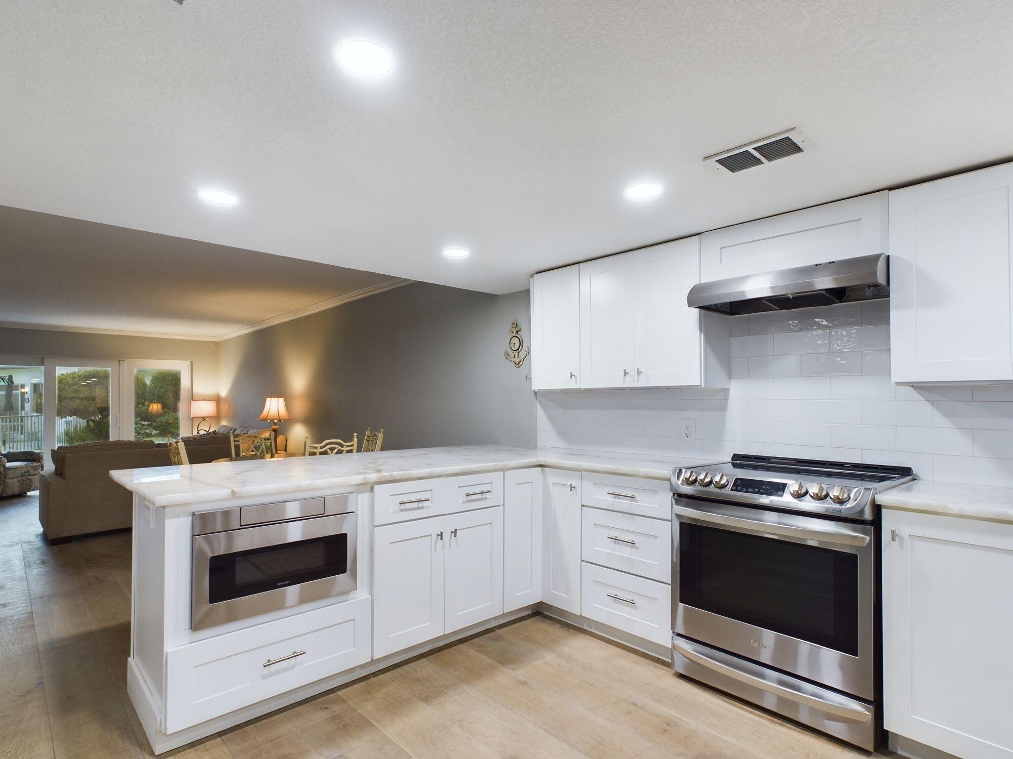 151 Calhoun Avenue, Unit 108 Destin, FL 32541 - Photo 5 of 30 a kitchen with a stove and a sink