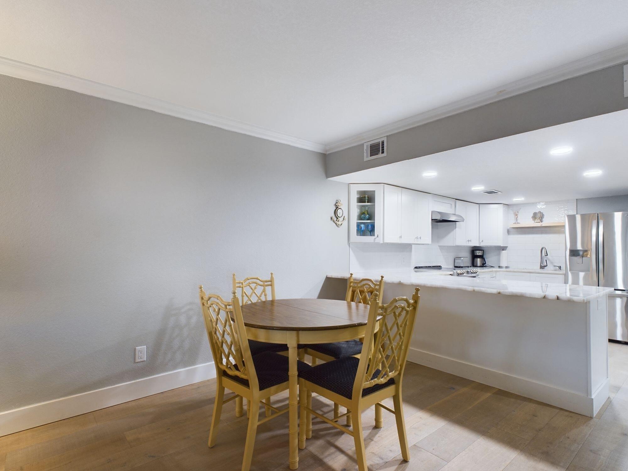 151 Calhoun Avenue, Unit 108 Destin, FL 32541 - Photo 6 of 30 a dining room with furniture and window