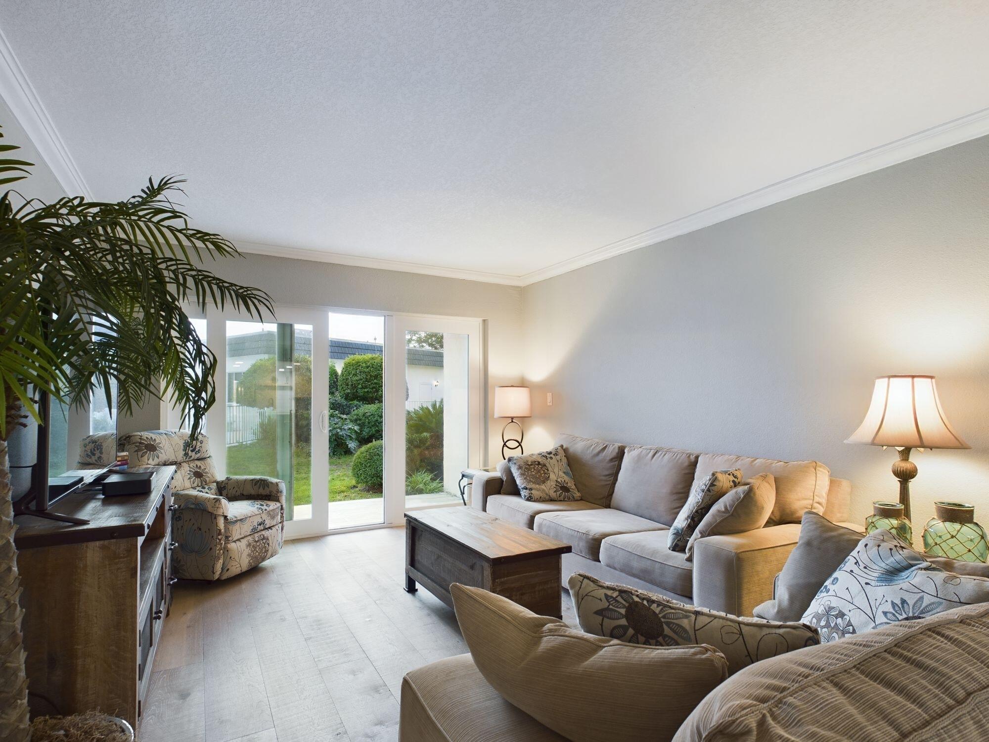 151 Calhoun Avenue, Unit 108 Destin, FL 32541 - Photo 9 of 30 a living room with furniture and a large window