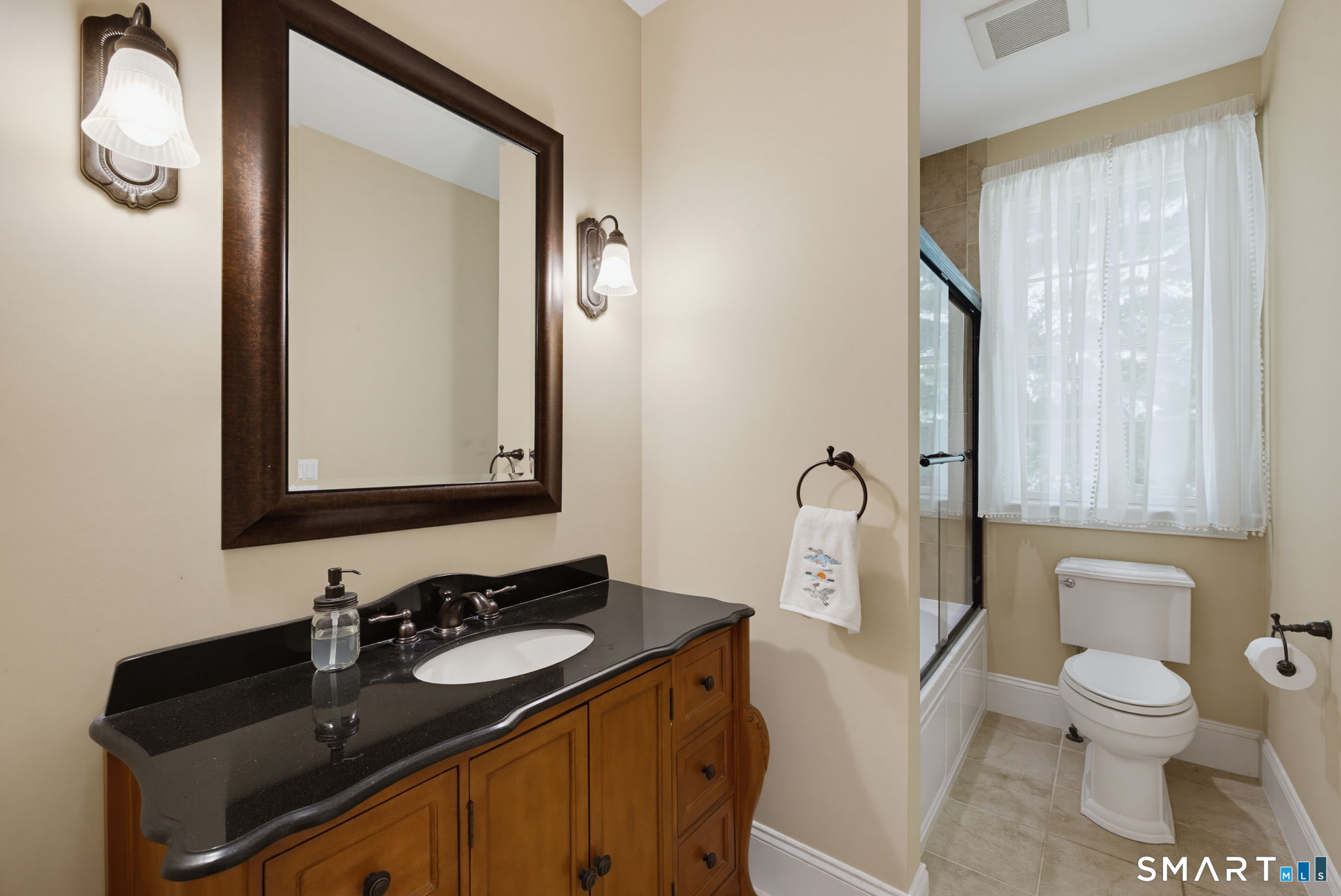 158 Appian Way Coventry, CT 06238 - Photo 28 of 40 a bathroom with a granite countertop sink toilet and mirror