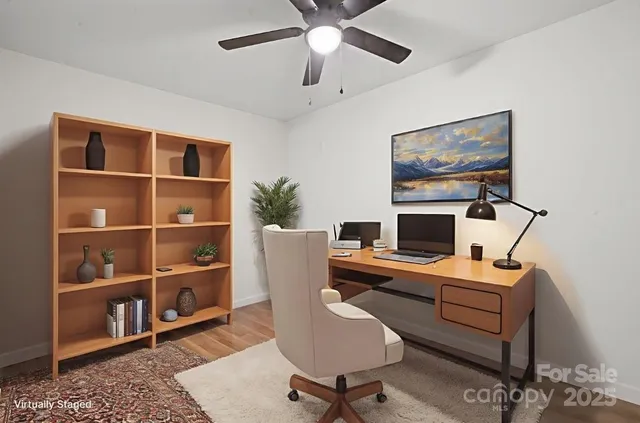 a workspace with furniture and a window