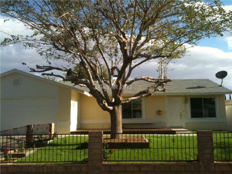 Property Photo. Bright Cheerful Exterior with New paint! Newly planted landscape!