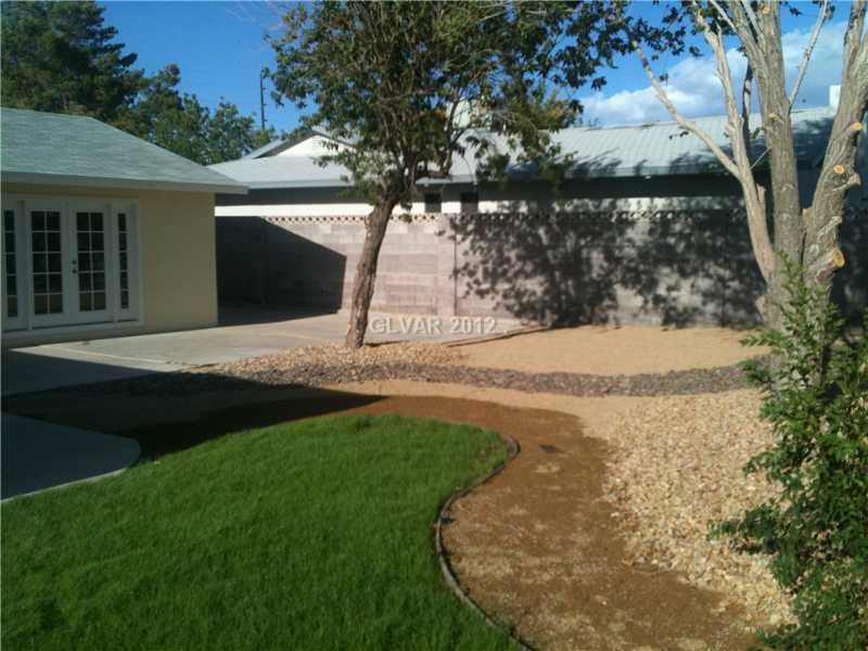 Exterior Back. Big Spacious Backyard with Trees, Desert and Lots of grass!