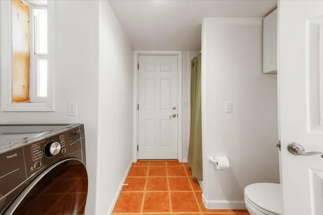 a view of a backyard with sitting area