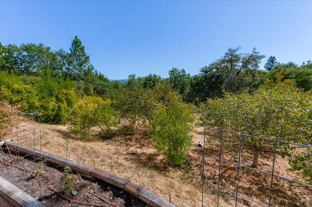 an aerial view of residential house and green space