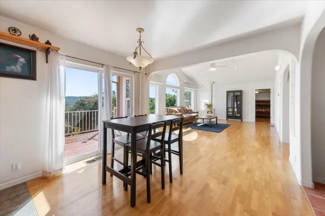 a kitchen with stainless steel appliances granite countertop a refrigerator a stove a sink and a microwave