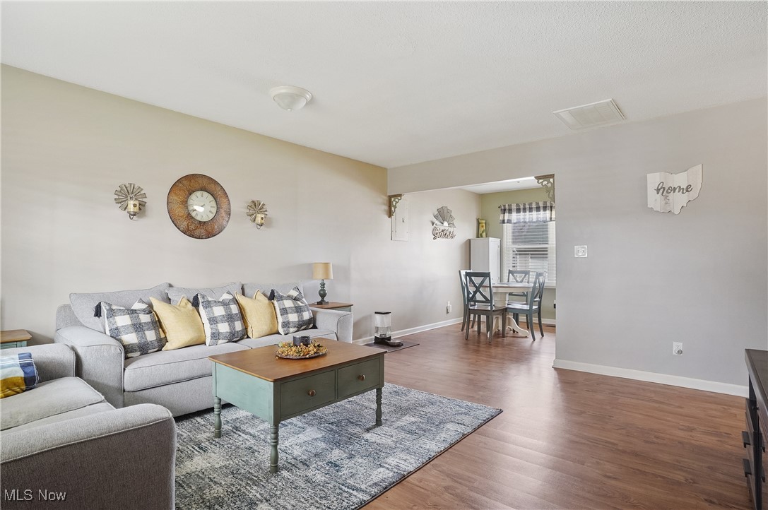 1533 Old Forge Road Kent, OH 44240 - Photo 2 of 33 Living area with visible vents, baseboards, and wood finished floors