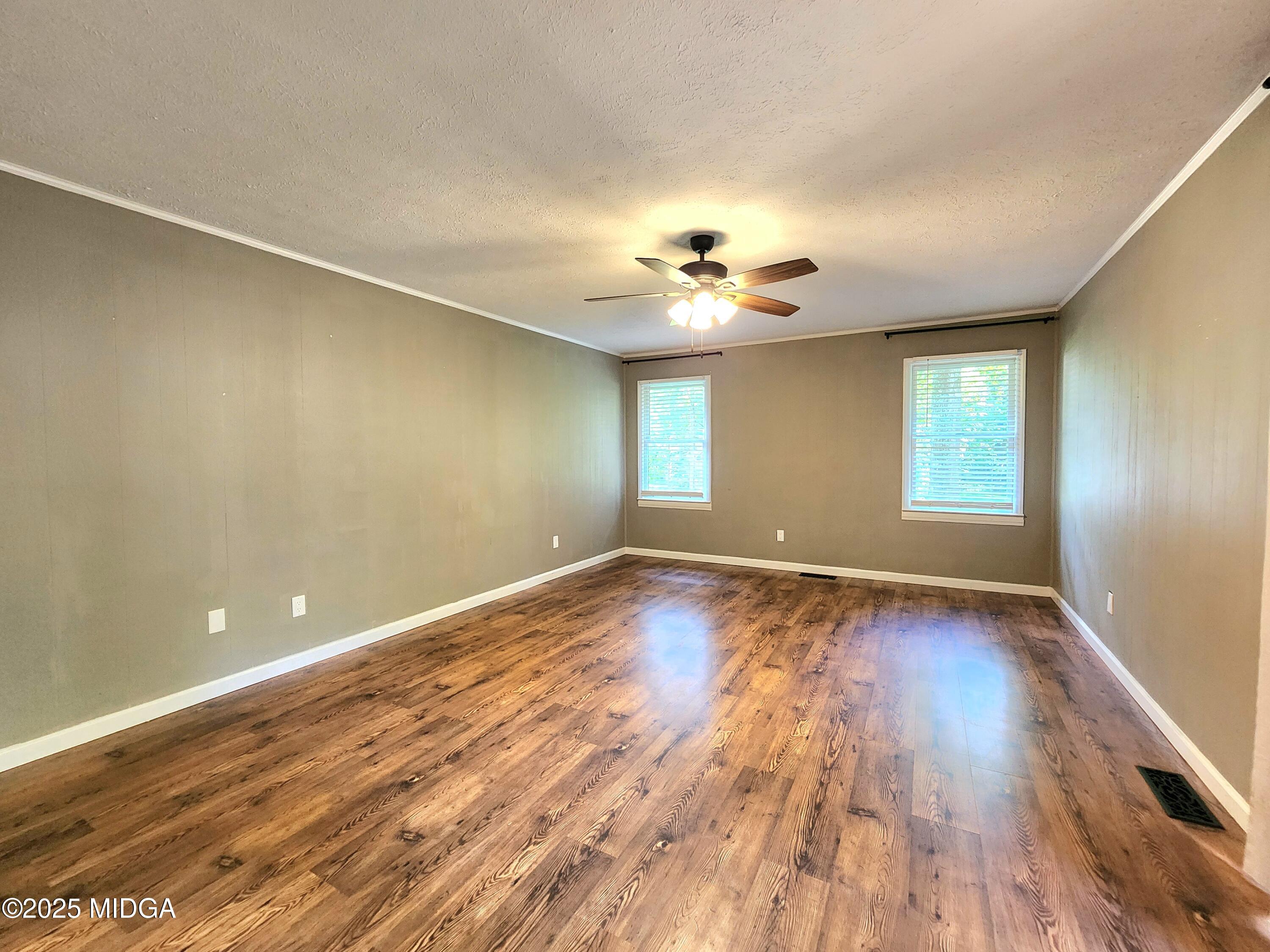 807 Wera Place Macon, GA 31210 - Photo 14 of 42 wooden floor in an empty room with a window