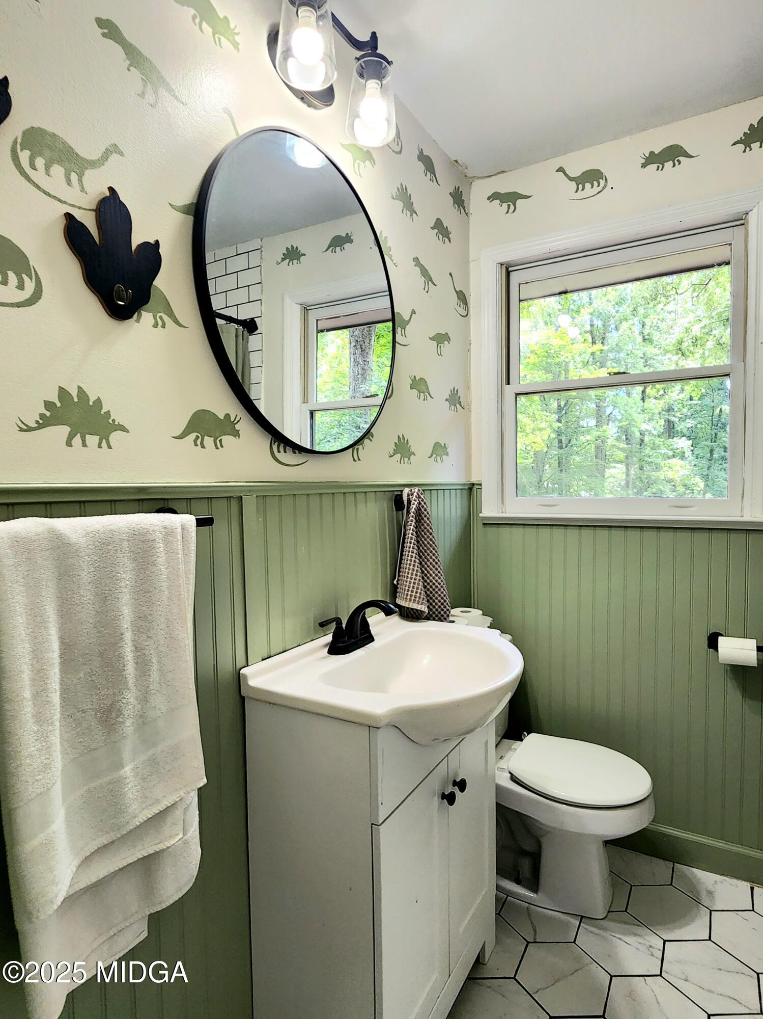 807 Wera Place Macon, GA 31210 - Photo 15 of 42 a bathroom with a toilet a sink and a mirror