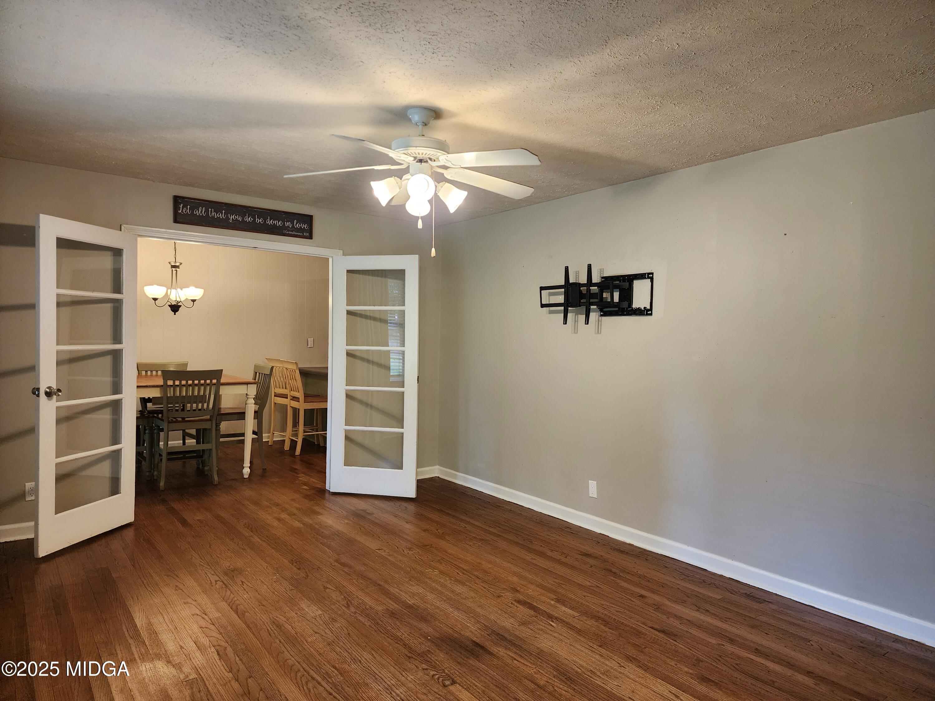 807 Wera Place Macon, GA 31210 - Photo 19 of 42 wooden floor in an empty room with a window