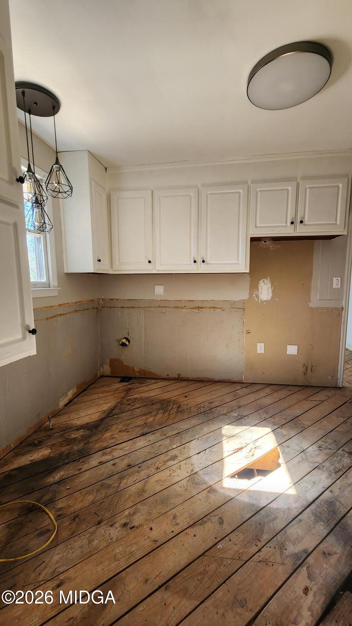 807 Wera Place Macon, GA 31210 - Photo 37 of 42 a view of kitchen and empty room with wooden floor