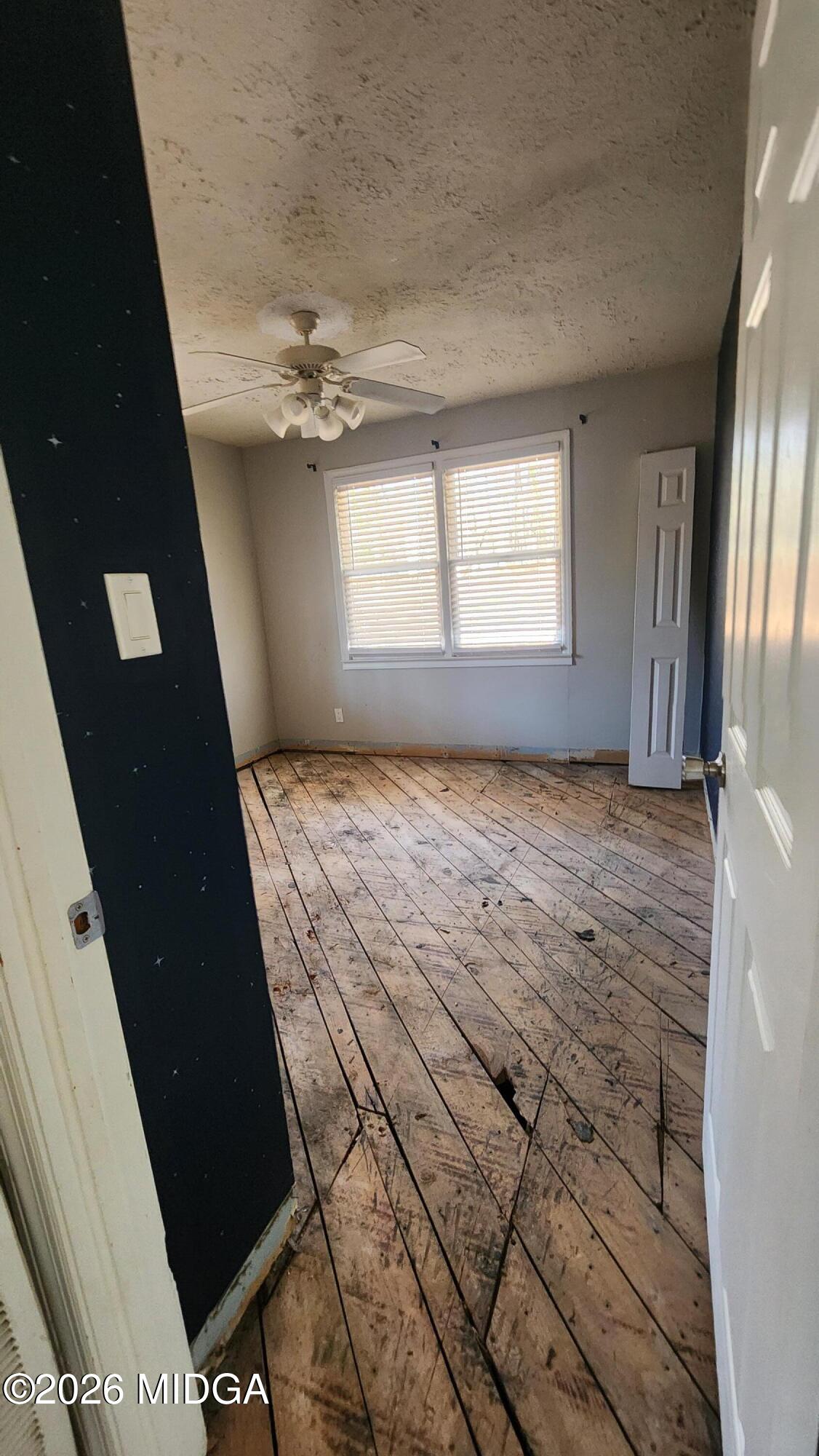807 Wera Place Macon, GA 31210 - Photo 41 of 42 wooden floor in an empty room with a window
