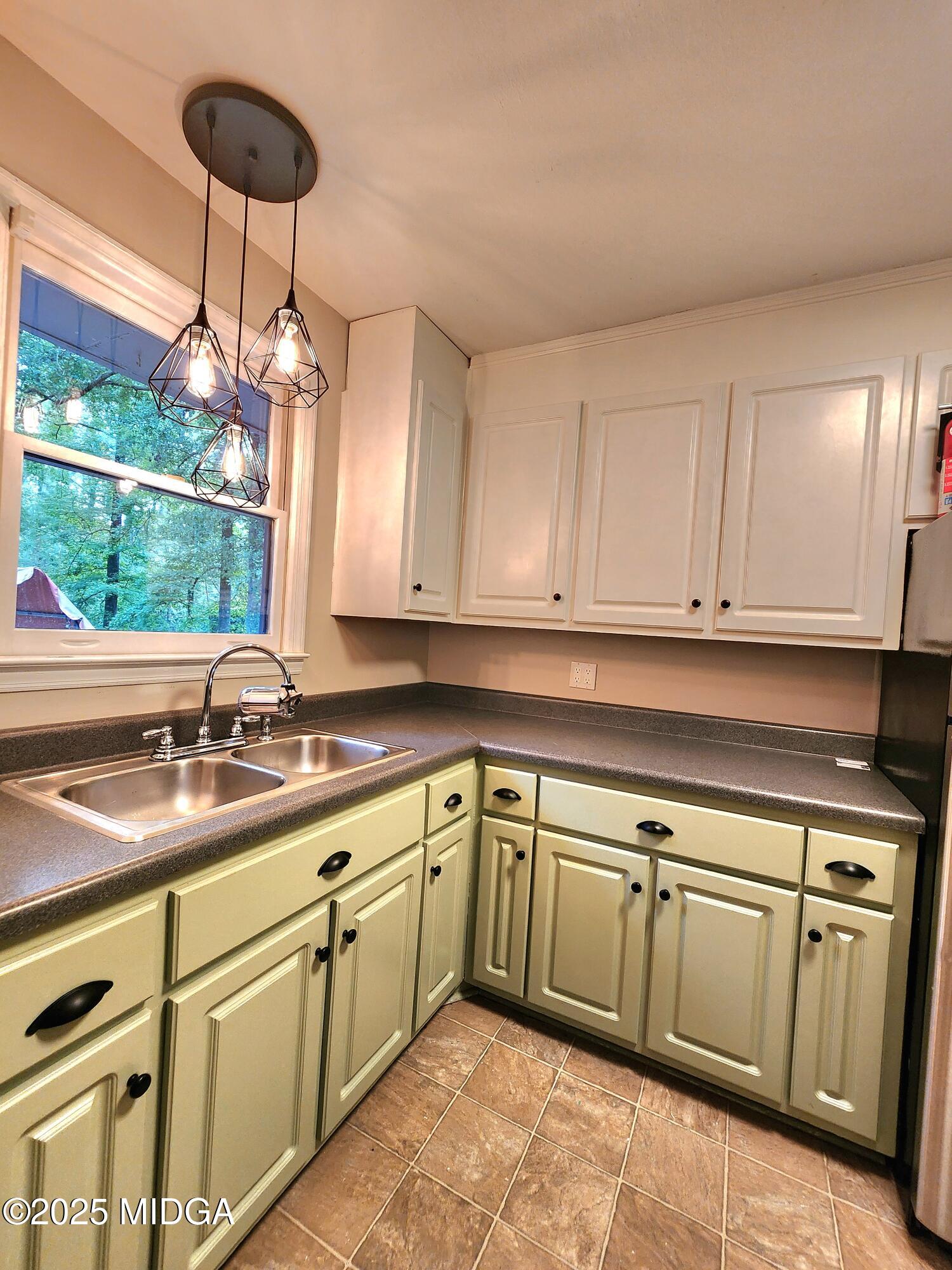 807 Wera Place Macon, GA 31210 - Photo 6 of 42 a kitchen with a sink cabinets and window