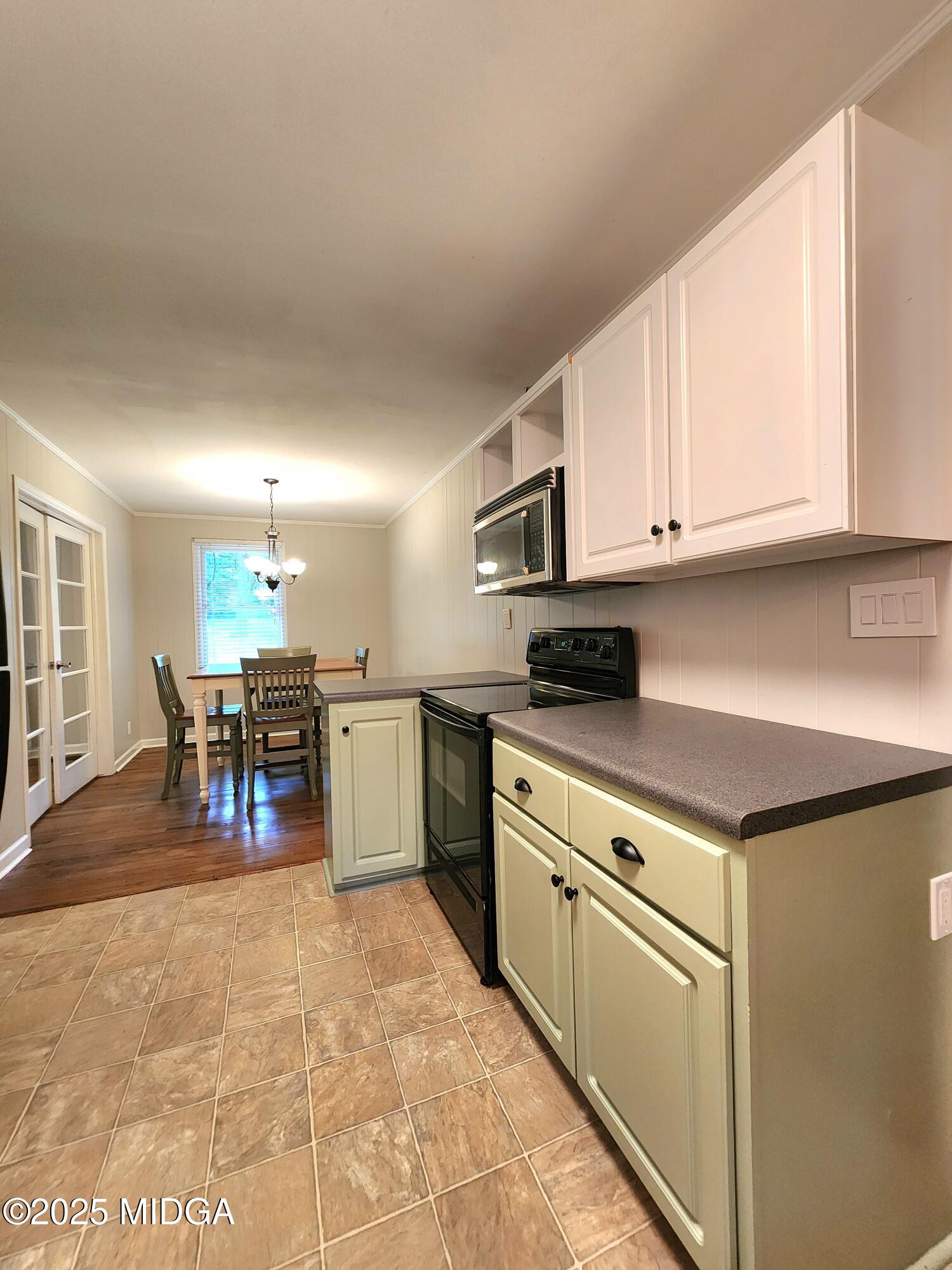 807 Wera Place Macon, GA 31210 - Photo 7 of 42 a kitchen with stainless steel appliances granite countertop a stove and a sink