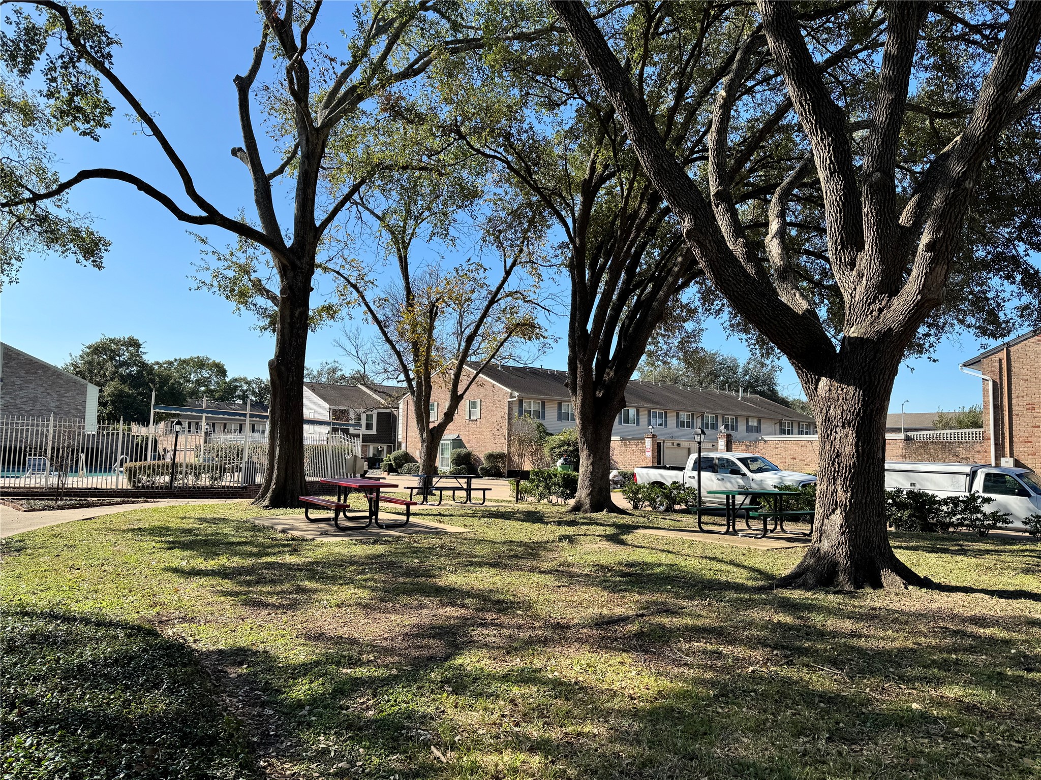 2041 Winrock Boulevard, Unit 157 Houston, TX 77057 - Photo 25 of 25 On-site green space lined with trees ideal for dog walking, outdoor play for the kids and relaxation.
