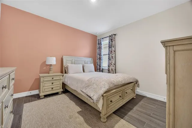 a bathroom with a granite countertop toilet sink and shower