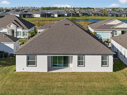 aerial view of a house with a ocean view
