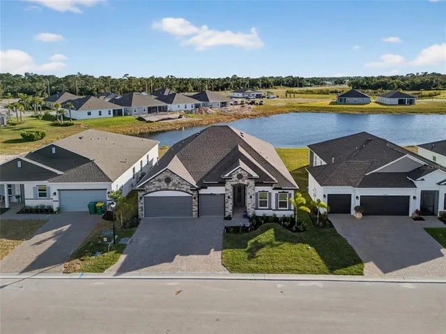 an aerial view of a pool table and chairs