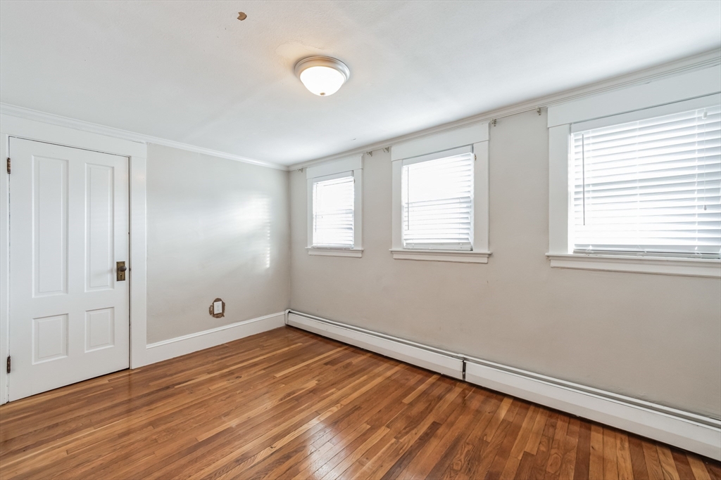 801 Boston Road Billerica, MA 01821 - Photo 21 of 29 an empty room with wooden floor and windows
