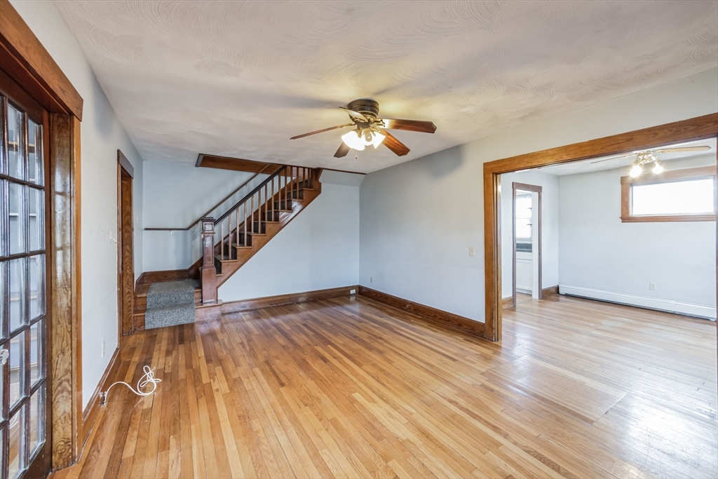 801 Boston Road Billerica, MA 01821 - Photo 6 of 29 a view of empty room with wooden floor and fan