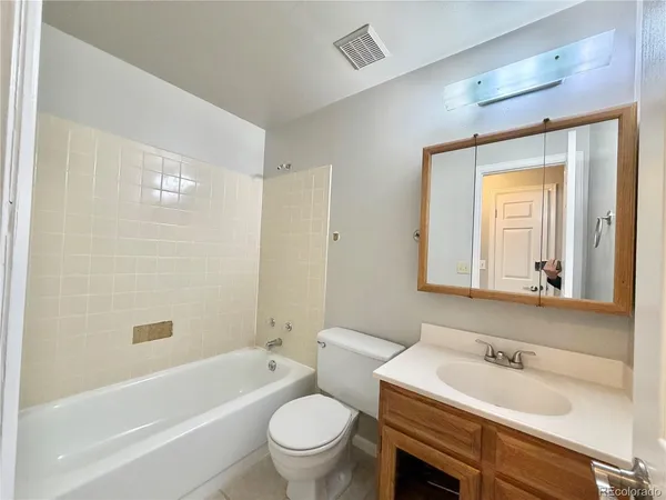 a bathroom with a sink a toilet and a bathtub