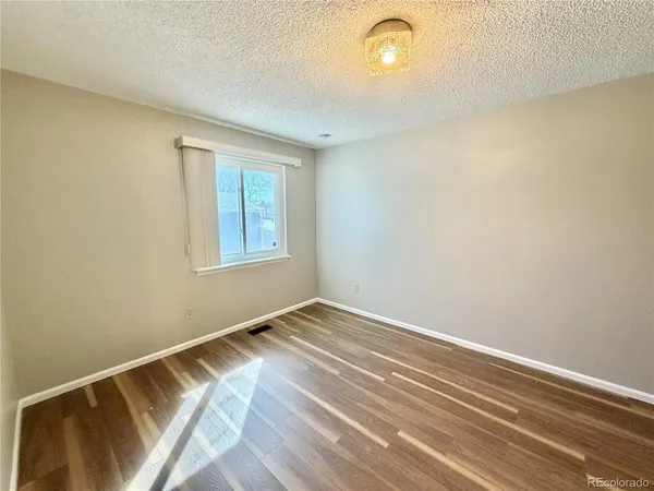 a view of room with window and ceiling fan