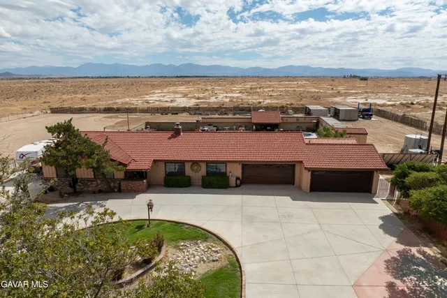 a swimming pool with an outdoor seating