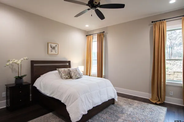 a bedroom with a large bed and a window