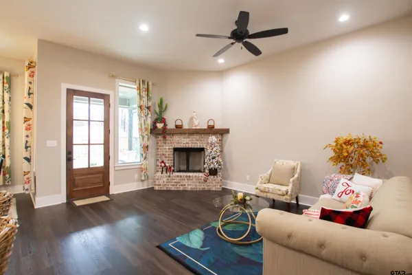 a living room with furniture and a fireplace