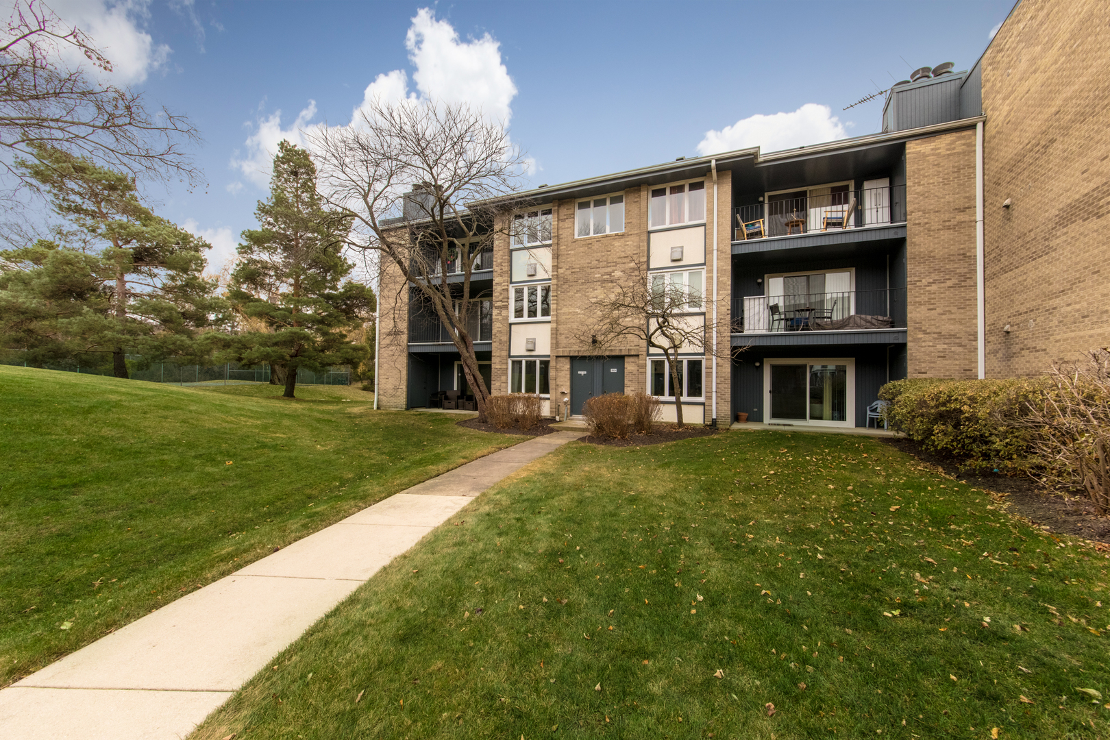 2021 Ammer Ridge Court, Unit 202 Glenview, IL 60025 - Photo 21 of 24 a front view of a house with garden