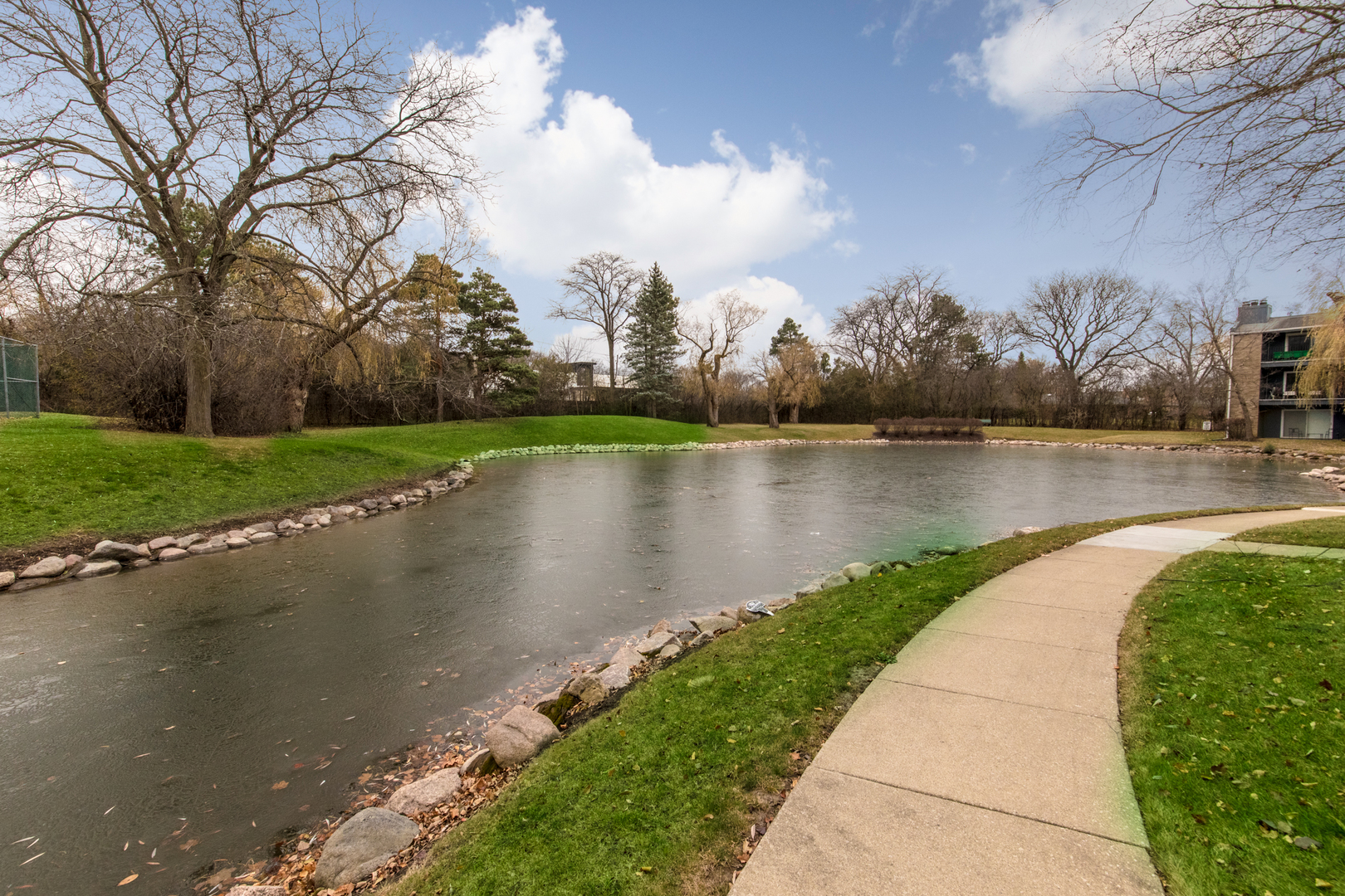 2021 Ammer Ridge Court, Unit 202 Glenview, IL 60025 - Photo 23 of 24 a view of a lake with a garden