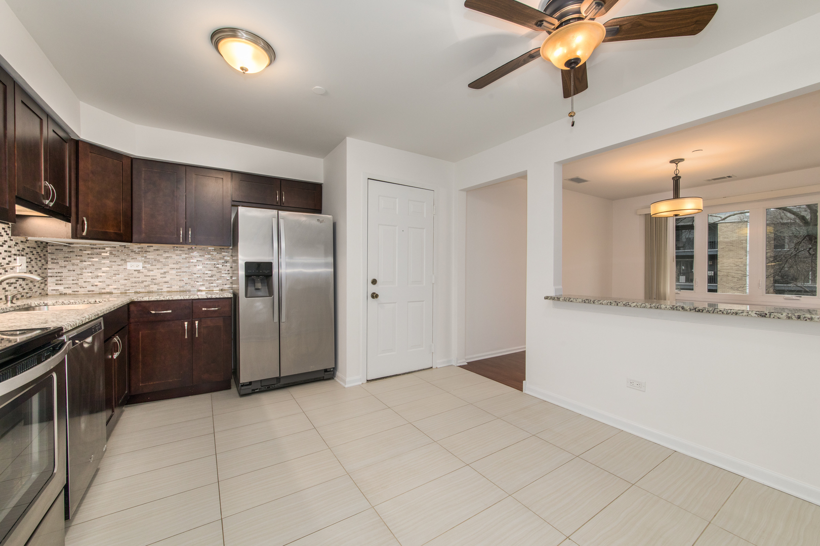 2021 Ammer Ridge Court, Unit 202 Glenview, IL 60025 - Photo 6 of 24 a kitchen with stainless steel appliances a refrigerator and a sink