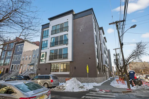 a front view of a building with street view