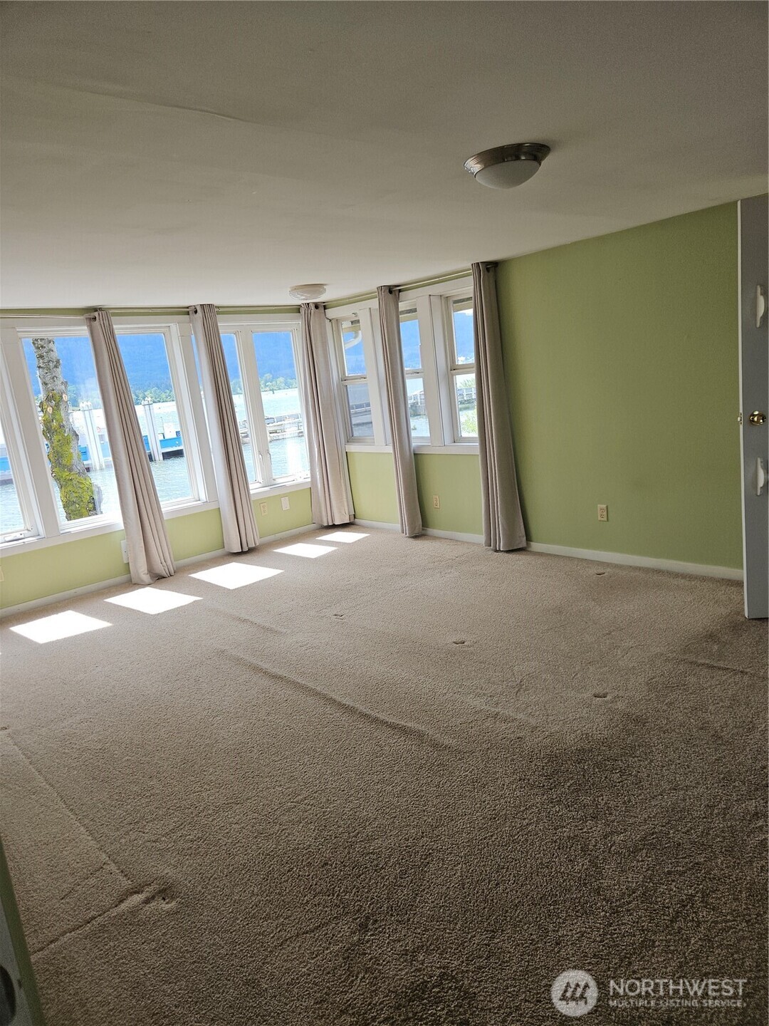 20 East Sunny Sands Road Cathlamet, WA 98612 - Photo 7 of 19 a view of an empty room with a window
