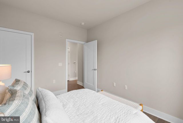 a bedroom with a bed and pillows