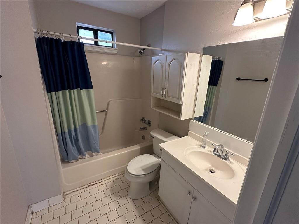 771 Farm Creek Road Northeast Woodstock, GA 30188 - Photo 2 of 14 a bathroom with a sink toilet and shower