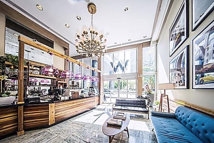 485 Brickell Avenue, Unit 2302 Miami, FL 33131 - Photo 17 of 20 a outdoor space with wooden benches and a couch