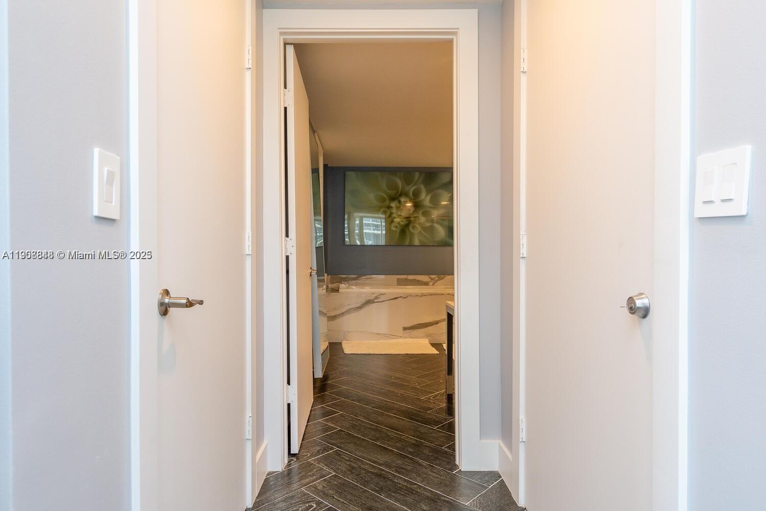 485 Brickell Avenue, Unit 2302 Miami, FL 33131 - Photo 10 of 20 a view of a hallway with a small space