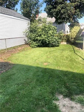 a view of a yard with an outdoor space