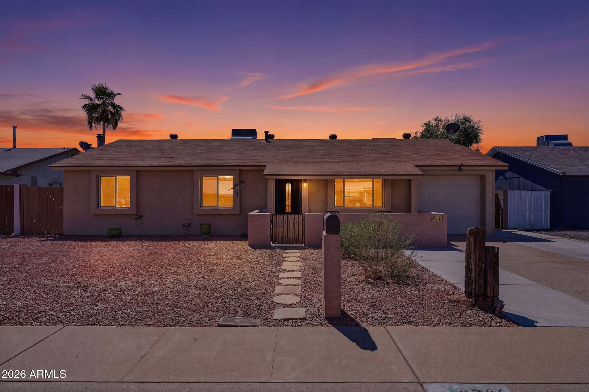 3765 East Pershing Avenue Phoenix, AZ 85032 - Photo 1 of 48 a front view of a house with a yard