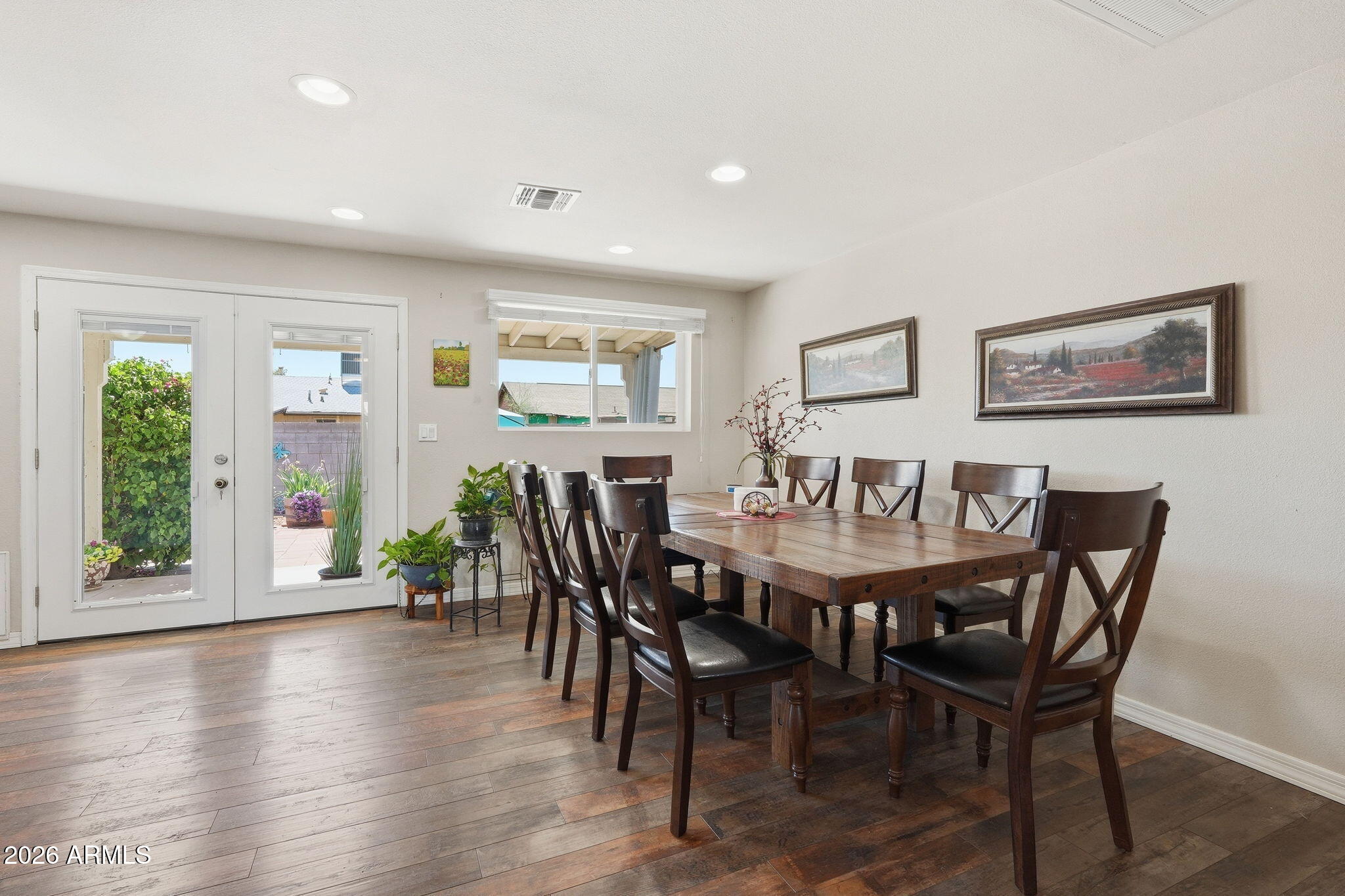 3765 East Pershing Avenue Phoenix, AZ 85032 - Photo 14 of 48 a view of a dining room with furniture and wooden floor