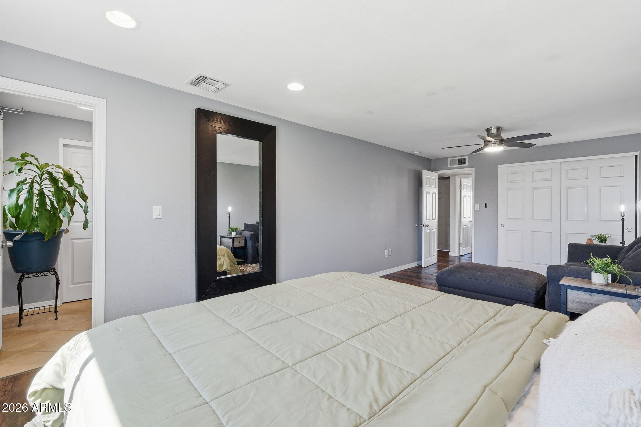 3765 East Pershing Avenue Phoenix, AZ 85032 - Photo 21 of 48 a bedroom with a bed and a potted plant
