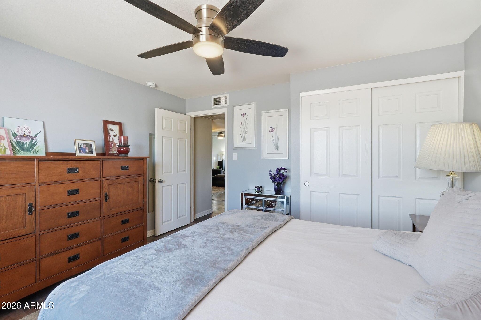 3765 East Pershing Avenue Phoenix, AZ 85032 - Photo 23 of 48 a bedroom with a bed and a chandelier
